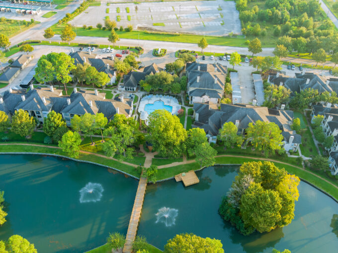 Aerial view of a single-family home neighborhood in Houston, Texas at sunset