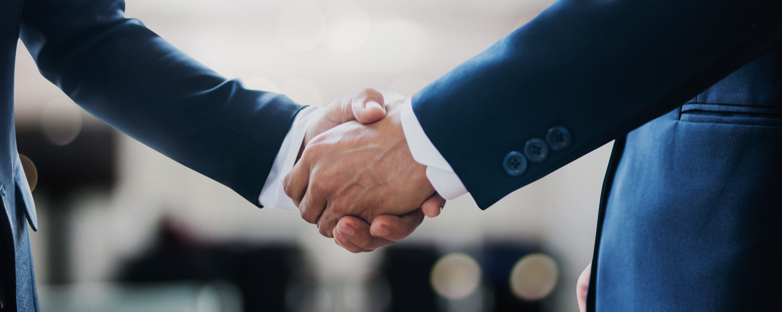 Handshake closing a direct real estate deal, no middlemen involved